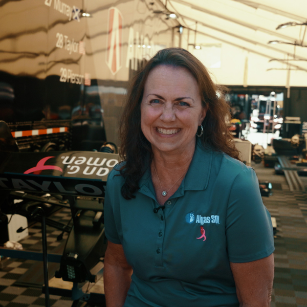 Julie Winans in the Andretti paddock wearing an Algas-SDI shirt